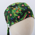 Side view of TMNT scrub cap showing green turtle characters and pizza slice pattern with tie detail