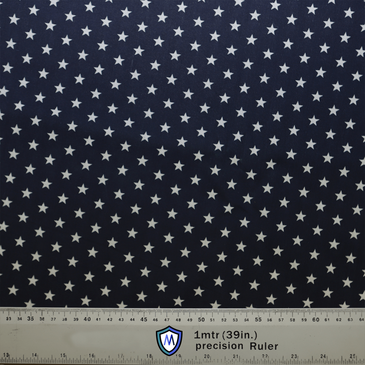 The USA Stars On Navy Scrub Cap by Medicus Scrub Caps is a dark blue fabric adorned with small white stars, ideal for reusable scrub caps. A 1-meter (39-inch) ruler at the bottom highlights its sustainable healthcare fashion focus.