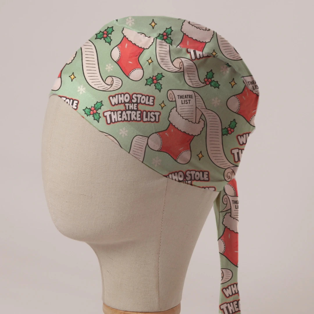 Who Stole The Theatre List scrub cap: Christmas stockings stuffed with long theatre lists and holly on sage green