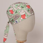 Who Stole The Theatre List scrub cap in Bandana tie-back style on mannequin head, front right view with the Medicus label
