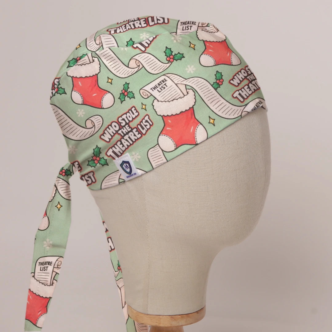 Who Stole The Theatre List scrub cap in Bandana tie-back style on mannequin head, front right view with the Medicus label