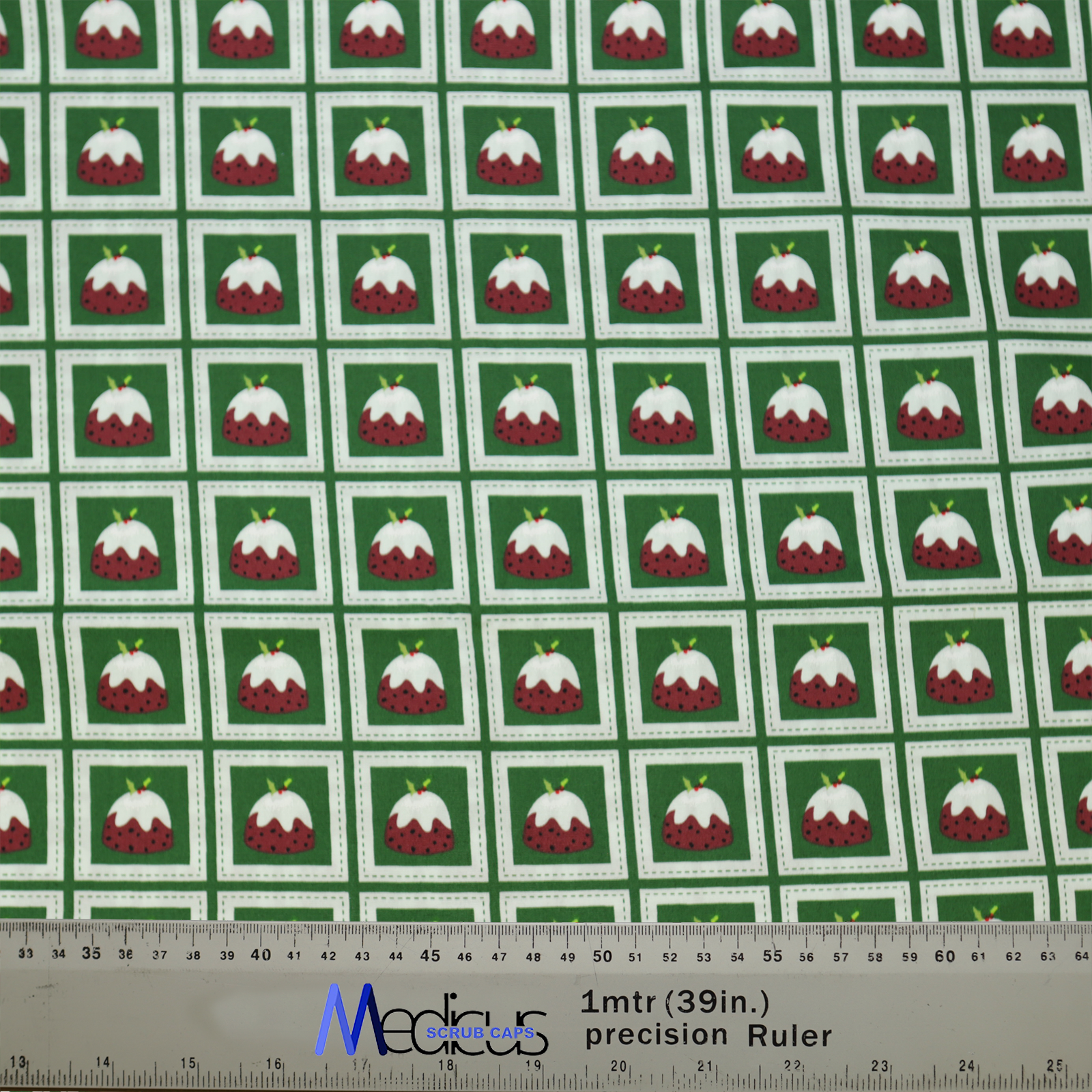 Christmas Puddings Green Grid Scrub Cap from Medicus Scrub Caps, featuring a festive pattern of Christmas puddings on a green grid background.