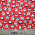 The Christmas Snow Globes Red Scrub Cap by Medicus Scrub Caps features festive snow globes and snowflakes on red fabric, with a scale ruler at the bottom.