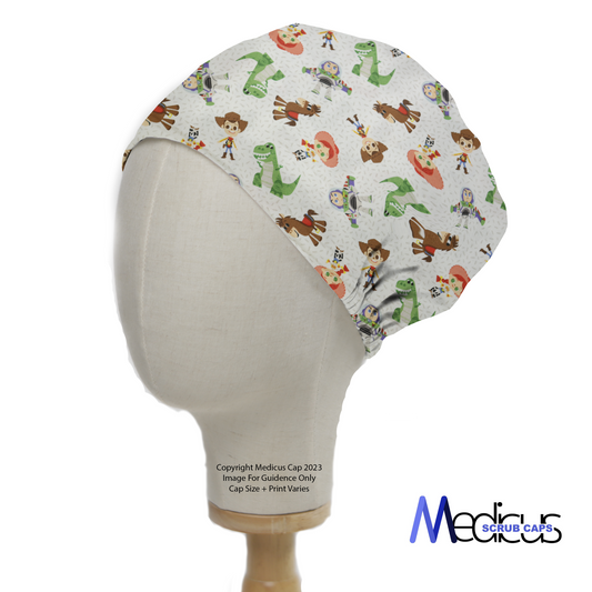 The Medicus Scrub Caps Disney Pixar Toy Story 2 Character Mashup Scrub Cap features cartoon characters like Woody, Buzz, and Rex on white fabric, displayed on a mannequin head.