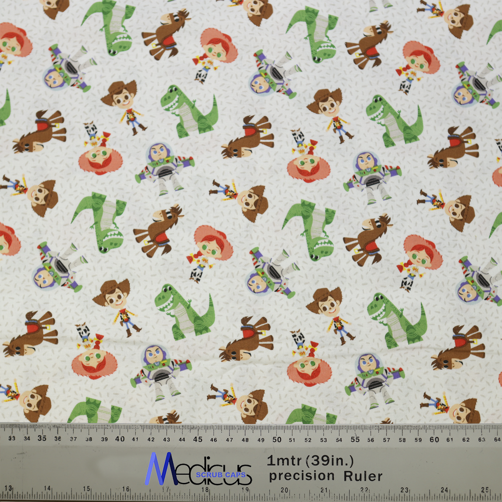 Medicus Scrub Caps fabric featuring a Disney Pixar Toy Story 2 character mashup with Woody, Buzz, Jessie, and more on a white background.