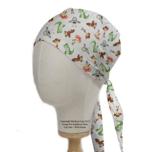 A mannequin head wears the Disney Pixar Toy Story 2 Character Mashup Scrub Cap by Medicus Scrub Caps, featuring beloved characters and a tie-back design.