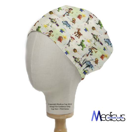 A mannequin head wears a Medicus Scrub Caps Disney Pixar Toy Story 3 On Mashup Green scrub cap, featuring beloved characters and an adjustable elastic fit.