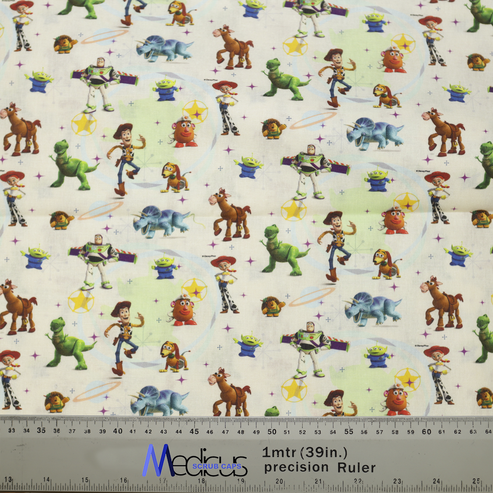 The Disney Pixar Toy Story 3 On Mashup Green Scrub Cap by Medicus Scrub Caps features beloved characters like Buzz, Woody, and Rex, plus a 1-meter precision ruler.