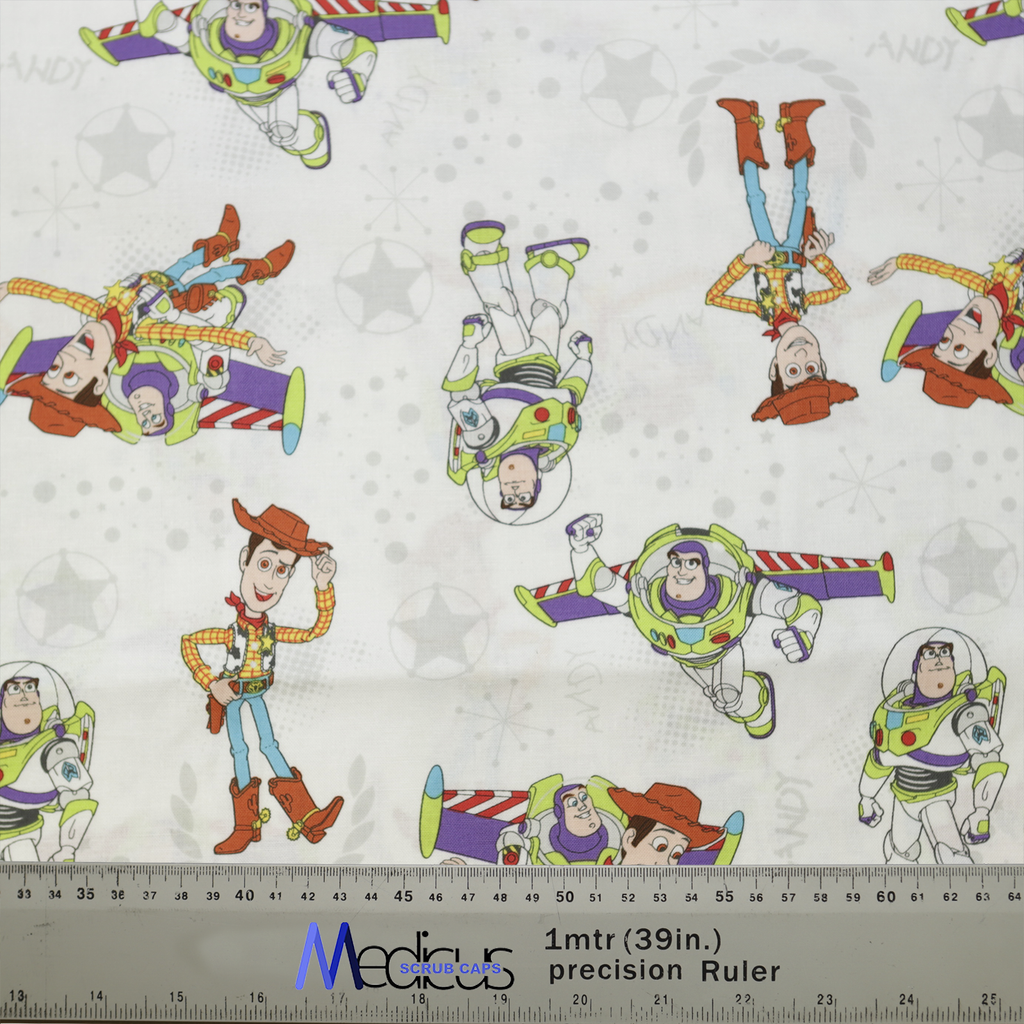 The Disney Pixar Toy Story Buzz Woody Flying White Scrub Cap by Medicus Scrub Caps features Buzz and Woody against a starry backdrop, with a measuring ruler.