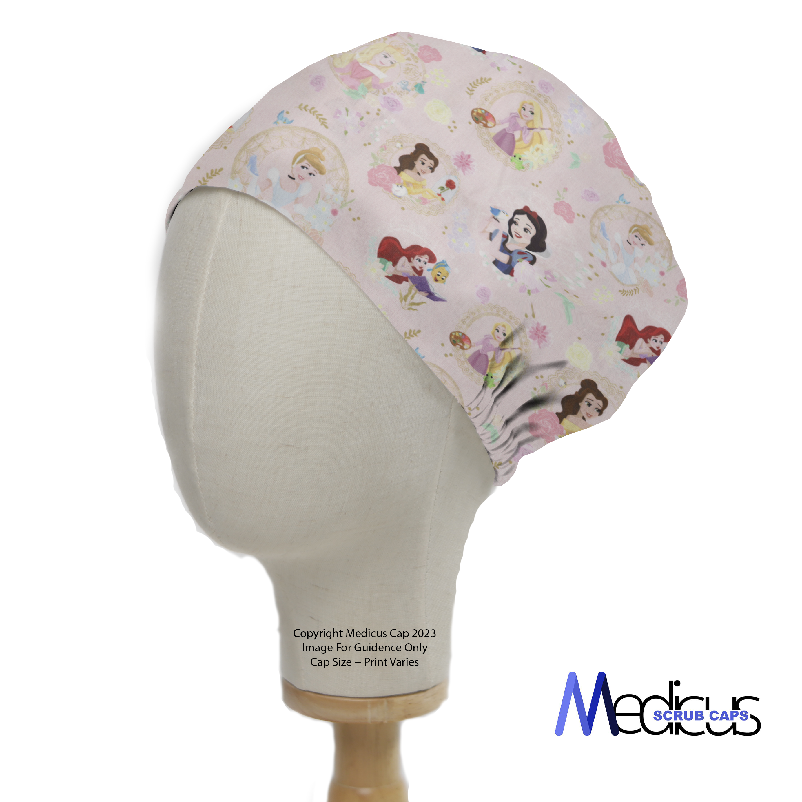 Displayed on a mannequin, the Disney Princesses Mashup Pink Scrub Cap by Medicus Scrub Caps features princesses on light pink fabric with an elastic band for comfort.