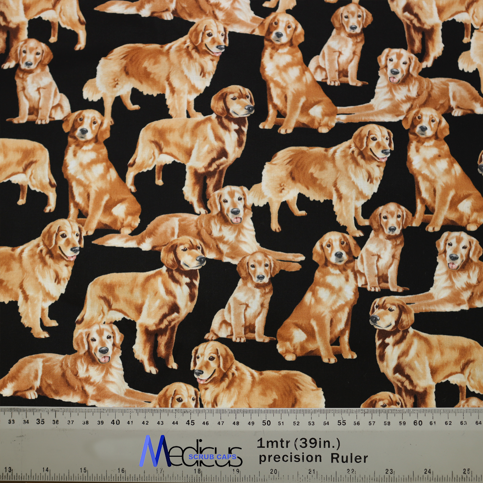 Medicus Scrub Caps Golden Retriever Scrub Cap features golden retrievers on a black background, crafted from eco-friendly fabric. A ruler provides scale.