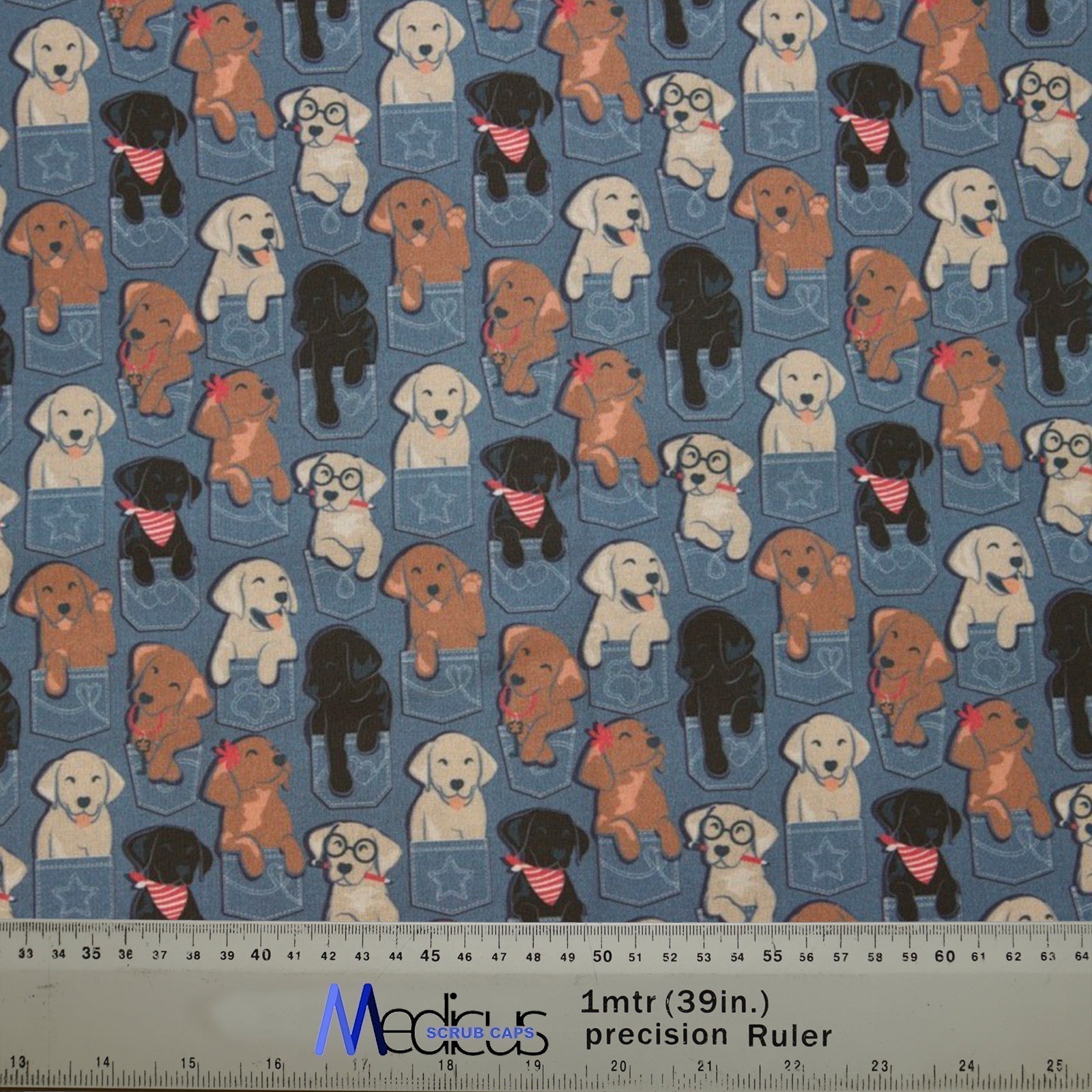 Medicus Scrub Caps Dogs In Jean Pockets fabric features cartoon puppies in denim pockets on a blue background, perfect for crafting a custom scrub cap.