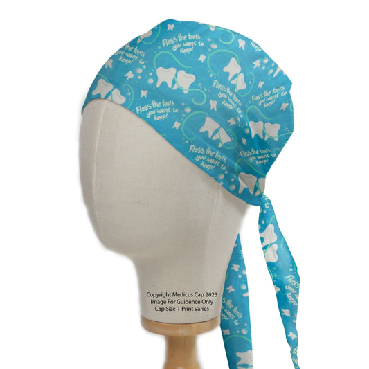 The eco-friendly Medicus Scrub Caps "Floss The Teeth You Want To Keep" Dentist Scrub Cap features white tooth graphics and a playful phrase on blue fabric.