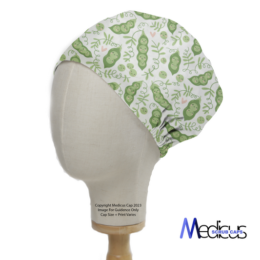 Food Peas In Pod Scrub Cap from Medicus Scrub Caps, featuring a playful green pea pod pattern on a white background.