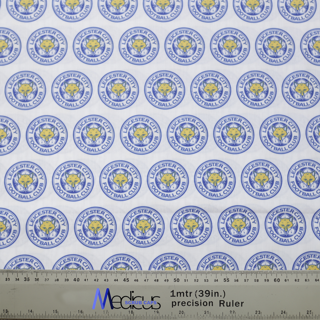 The Football Club Leicester Scrub Cap by Medicus Scrub Caps features a repeating Leicester City logo pattern in blue and yellow, perfect for sports-loving healthcare professionals.