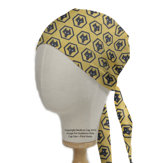 A Football Club Wolverhampton Scrub Cap by Medicus Scrub Caps, featuring a bold yellow design with black wolf emblems, elegantly tied on a mannequin head.