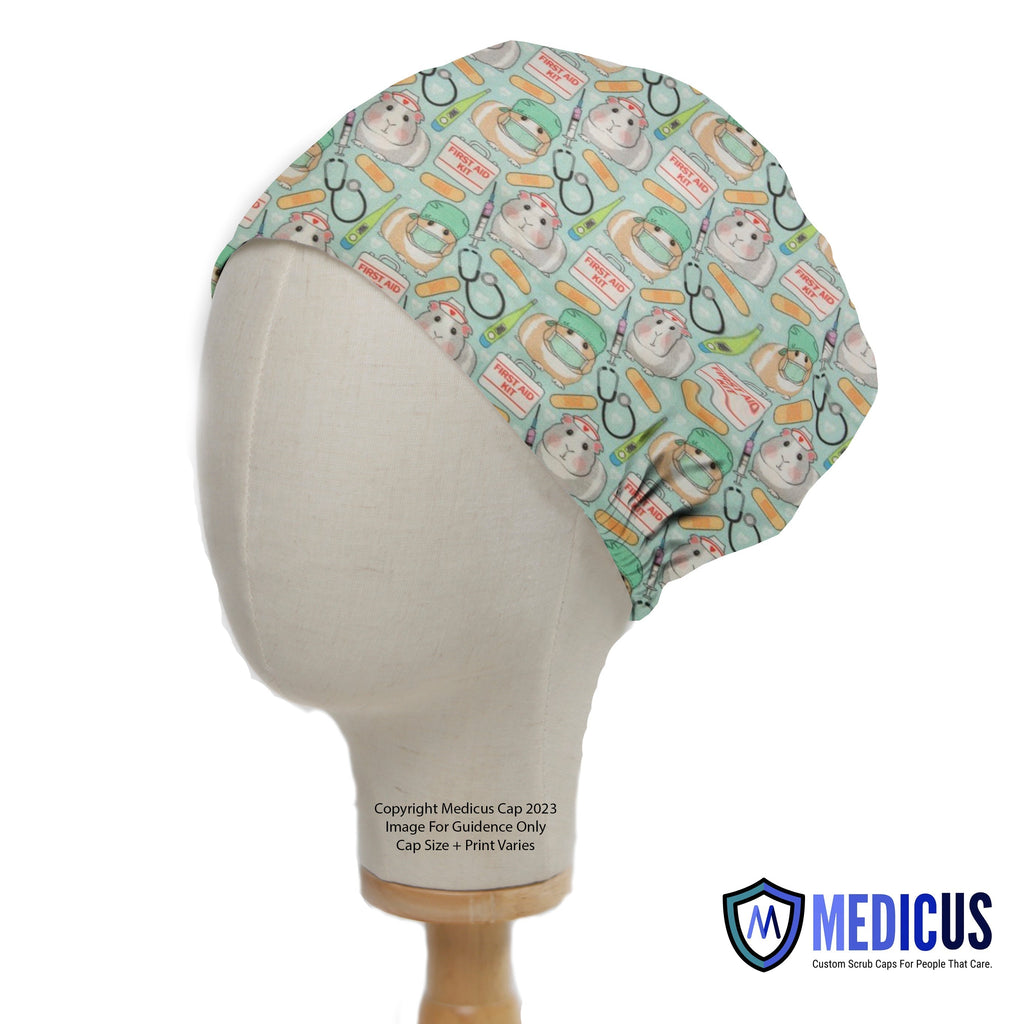 Guinea Pig Doctors First Aid Scrub Cap from Medicus Scrub Caps, featuring adorable guinea pigs, medical tools, and first aid designs on a mint green background.