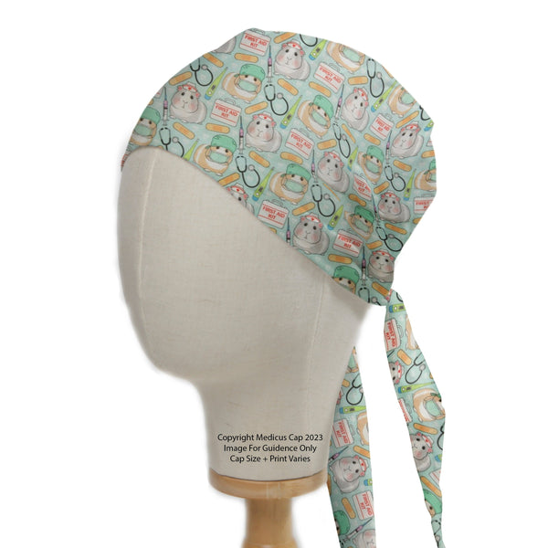 Guinea Pig Doctors First Aid Scrub Cap from Medicus Scrub Caps, featuring a medical-themed pattern with cute guinea pigs, stethoscopes, and first aid kits.