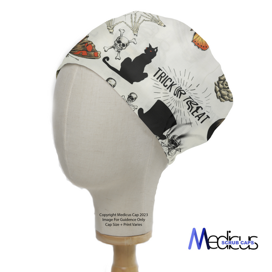 On a mannequin head, a Medicus Scrub Caps eco-friendly Halloween Trick or Treat Large Scrub Cap features black cats, skulls, pumpkins, and spooky motifs for a festive touch.