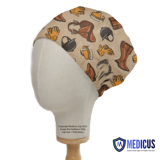 Horse Accessories Equestrian Scrub Cap from Medicus Scrub Caps, featuring a beige background with horse riding gear, including saddles, boots, gloves, and helmets.