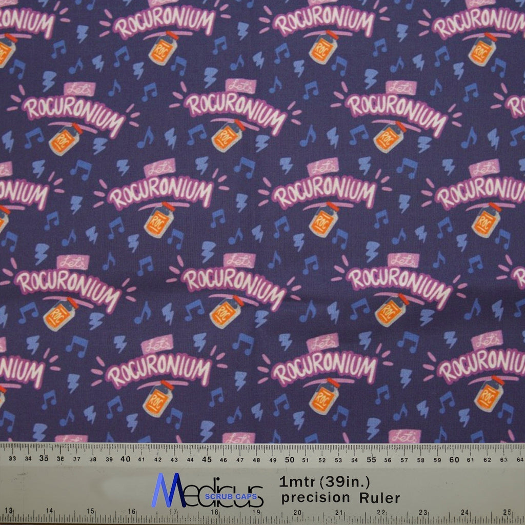 The Let's Rocuronium Scrub Cap by Medicus Scrub Caps features a dark blue background with Rocuronium bottles, music notes, and a ruler for size reference.