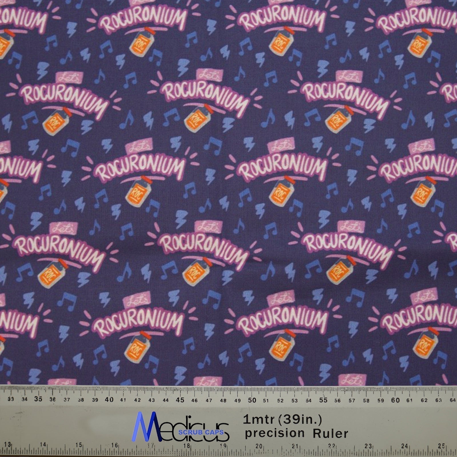 The Let's Rocuronium Scrub Cap by Medicus Scrub Caps features a dark blue background with Rocuronium bottles, music notes, and a ruler for size reference.
