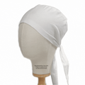 Displayed on a beige mannequin head, the Classic Plain Scrub Cap from Medicus Scrub Caps exudes elegance. Its white design is functional yet stylish, tied at the back with cascading ends against a white background. Available in XS to 2XL sizes and 22 colors.