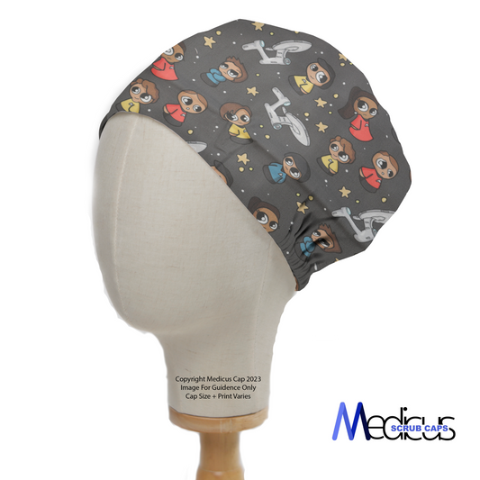 A mannequin head displays the Space Cartoon Star Trek Kawaii Scrub Cap by Medicus Scrub Caps, featuring a playful space-themed cartoon pattern on a dark background.