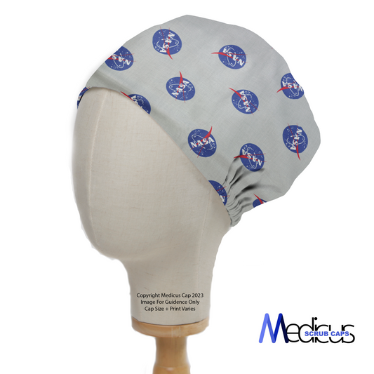 The Space NASA Logos Circles Scrub Cap by Medicus Scrub Caps features NASA logos on light gray fabric, a gathered back for fit, displayed on a mannequin head.