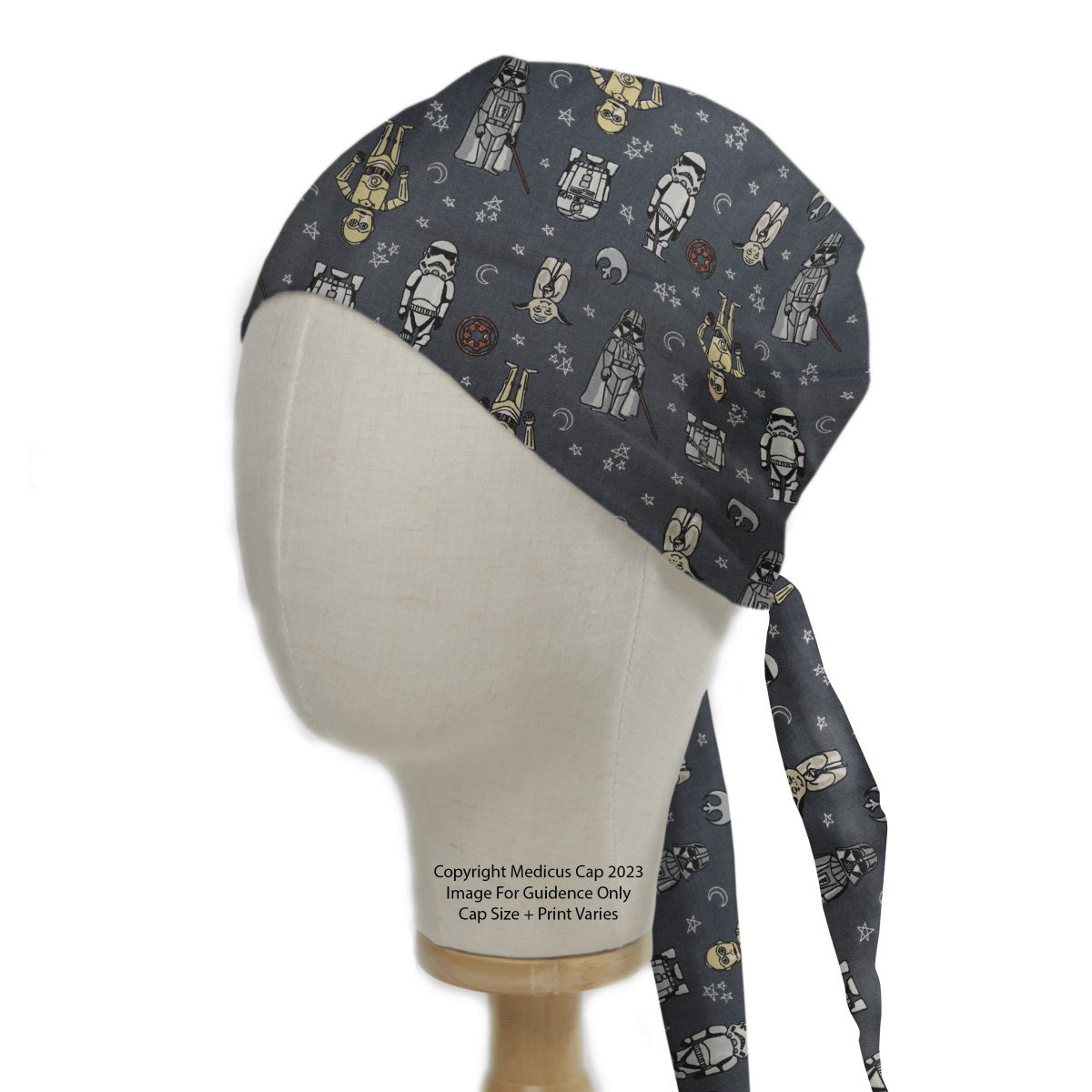 A Star Wars-themed grey scrub cap by Medicus Scrub Caps, featuring characters, stars, and planets, displayed on a mannequin head for a cosmic touch.
