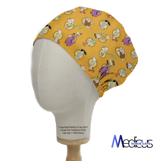 A mannequin head displays a Medicus Scrub Caps Flintstones scrub cap, featuring classic cartoon characters on an orange background.