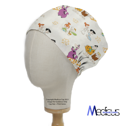 The TV Cartoon Flintstones Wild Scrub Cap by Medicus Scrub Caps features colorful Flintstones characters and text on a mannequin head, combining nostalgia with comfort.