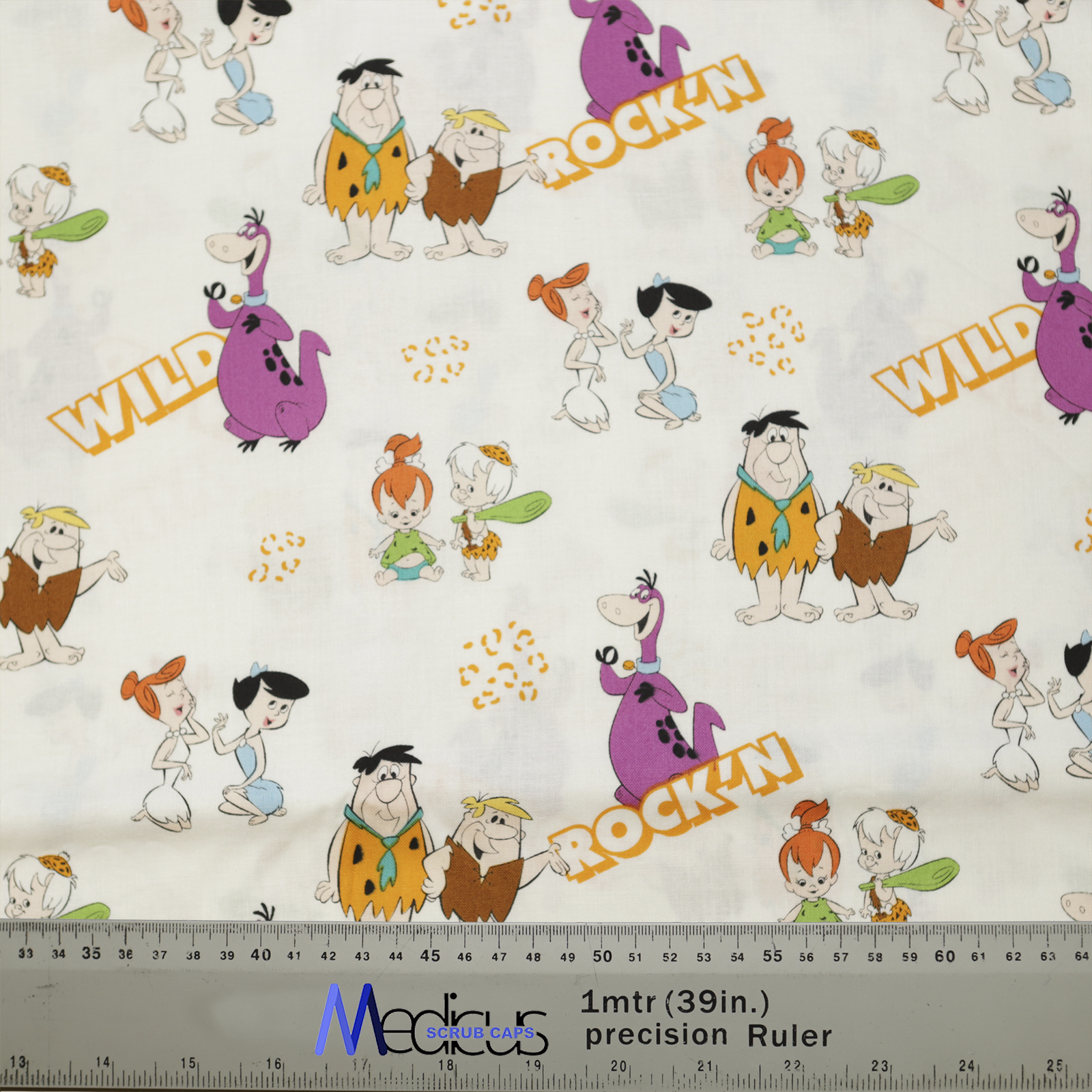 The TV Cartoon Flintstones Wild Scrub Cap by Medicus Scrub Caps features Flintstones characters, "WILD" and "ROCK'N" text, and a ruler at the bottom edge.