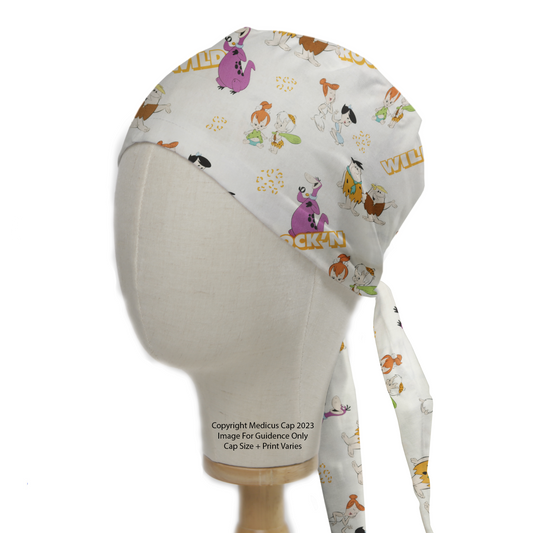 A mannequin head displays the Medicus Scrub Caps TV Cartoon Flintstones Wild Scrub Cap, featuring colorful Flintstones characters and playful text on a white background.