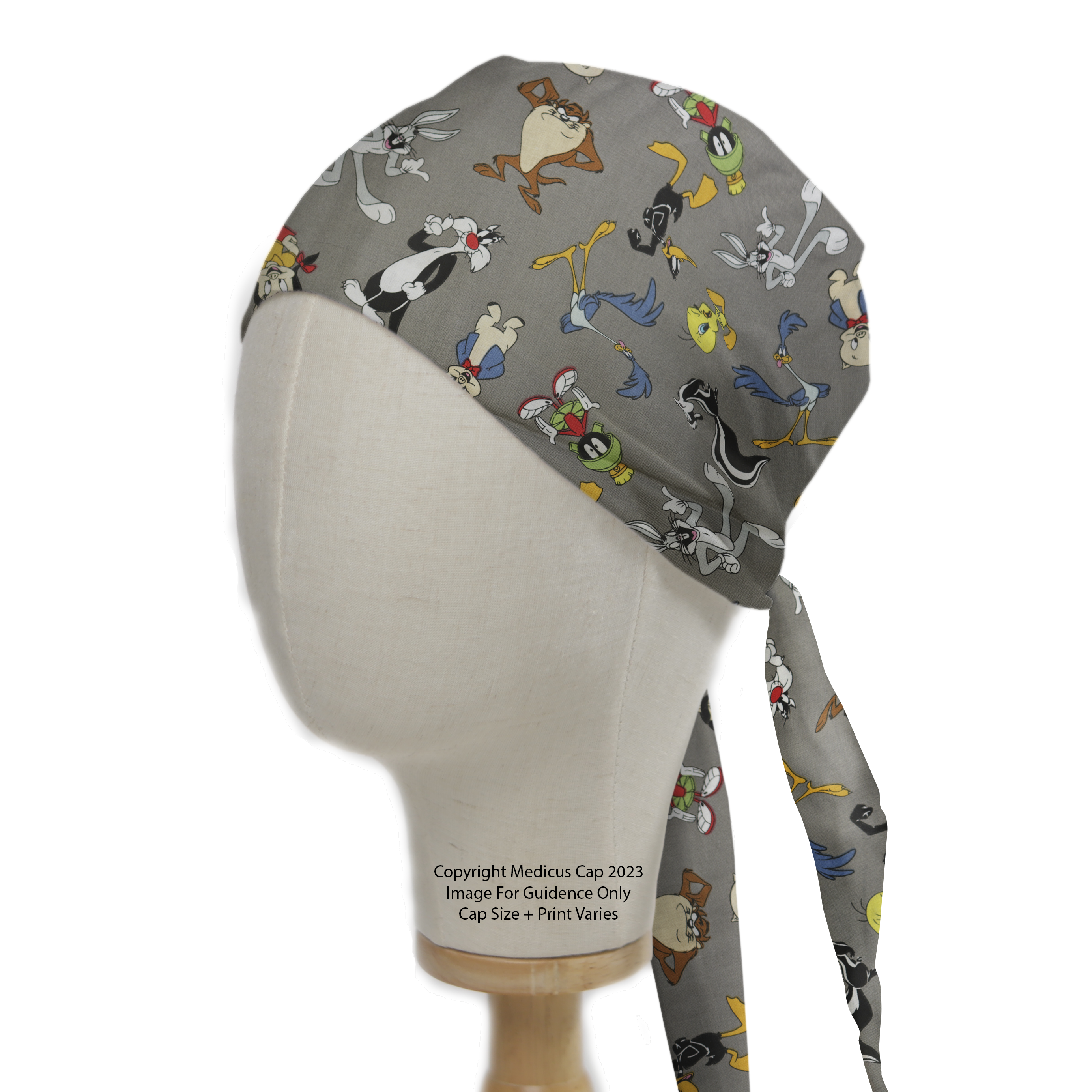 A mannequin head wears the Medicus Scrub Caps TV Cartoon Looney Tunes Character Mashup On Grey Scrub Cap, featuring classic characters with tie-back closure.