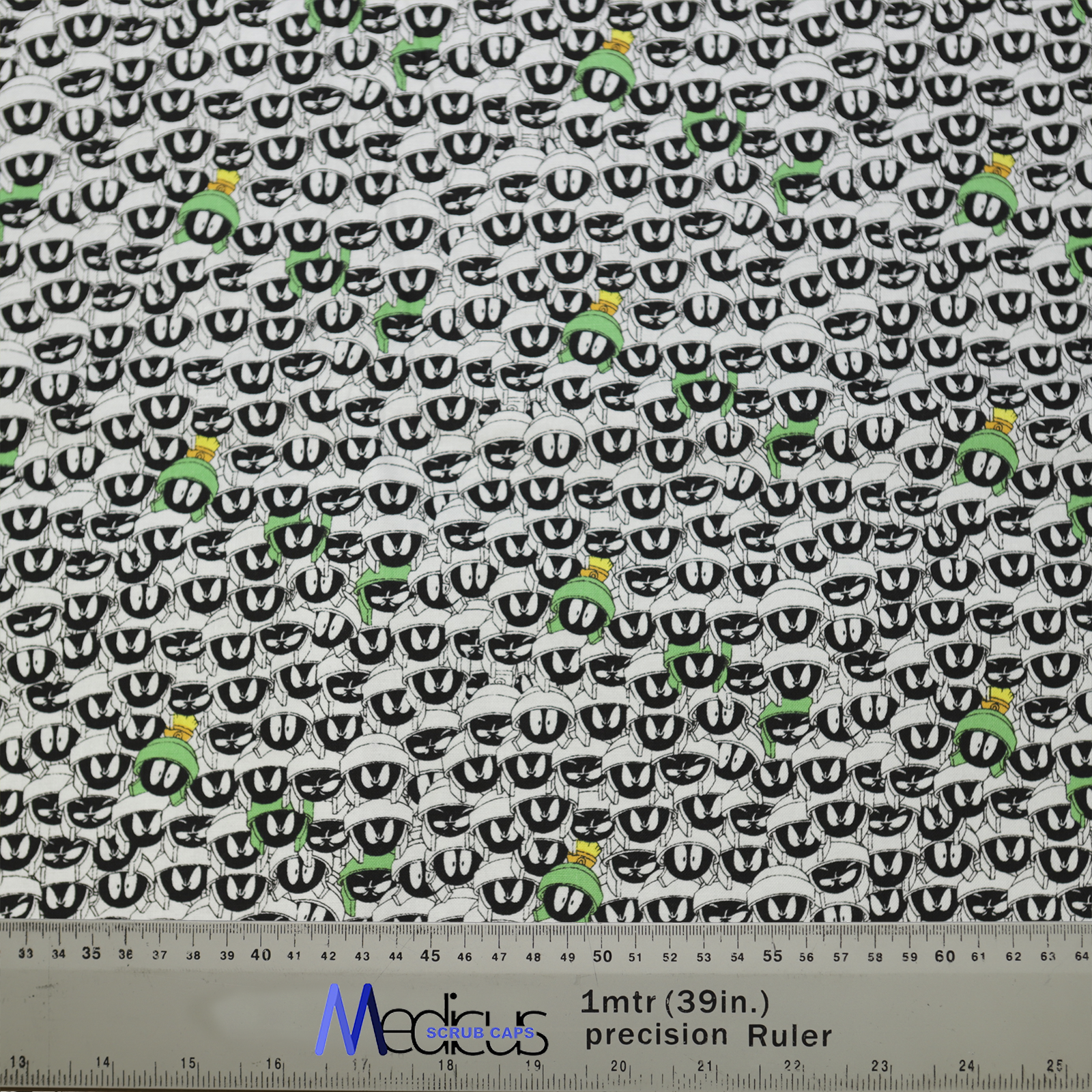 The TV Cartoon Looney Tunes Marvin Martian Crowd Scrub Cap by Medicus Scrub Caps features a pattern of cartoon eyes with some in green helmets.