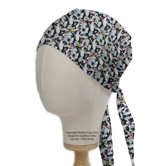 A side-angle view of a Medicus Scrub Caps TV Cartoon Looney Tunes Sylvester and Tweety Bird scrub cap, featuring playful character prints and long ties.