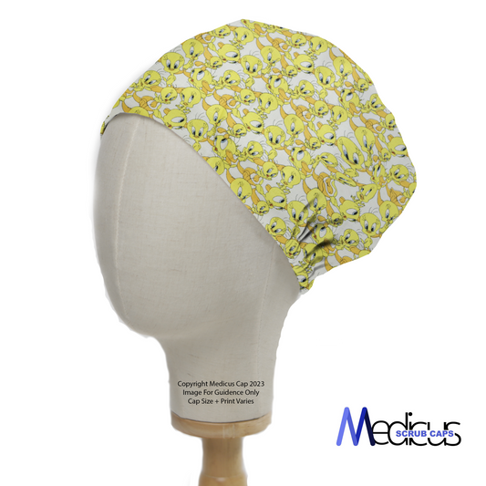 A mannequin head displays the Medicus Scrub Cap featuring a fun yellow Tweetie Bird pattern, combining style and comfort for medical professionals.