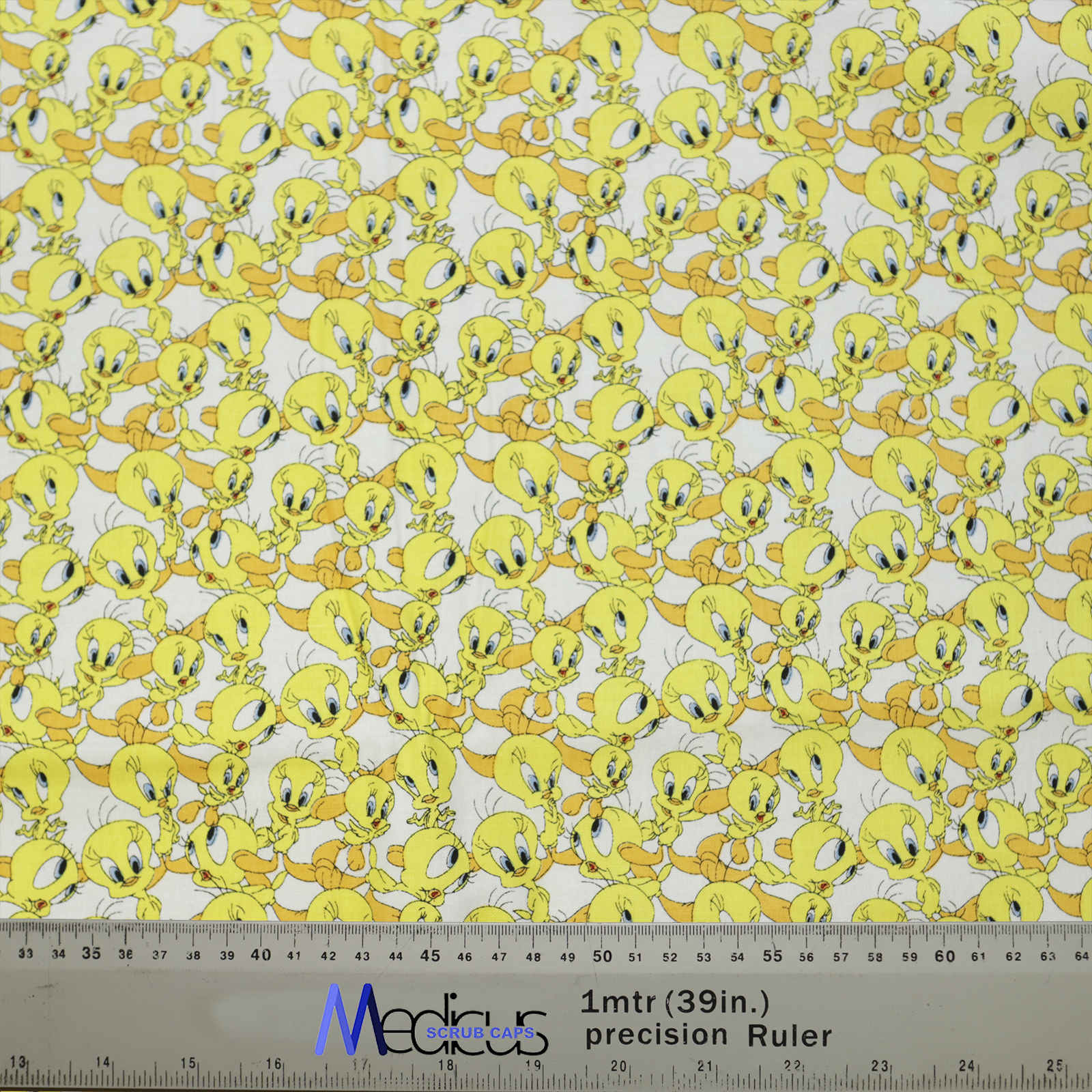 The TV Cartoon Looney Tunes Tweety Bird Scrub Cap by Medicus Scrub Caps features a playful Tweety pattern, perfect for adding fun to medical wear.