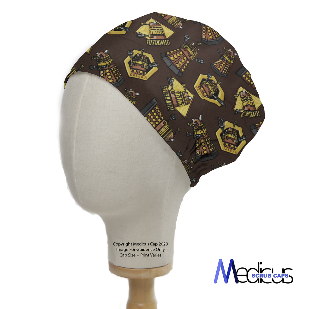 A mannequin head displays a Medicus Scrub Caps Dr Who Dalek Brown scrub cap, featuring yellow and black Dalek patterns on a brown background.