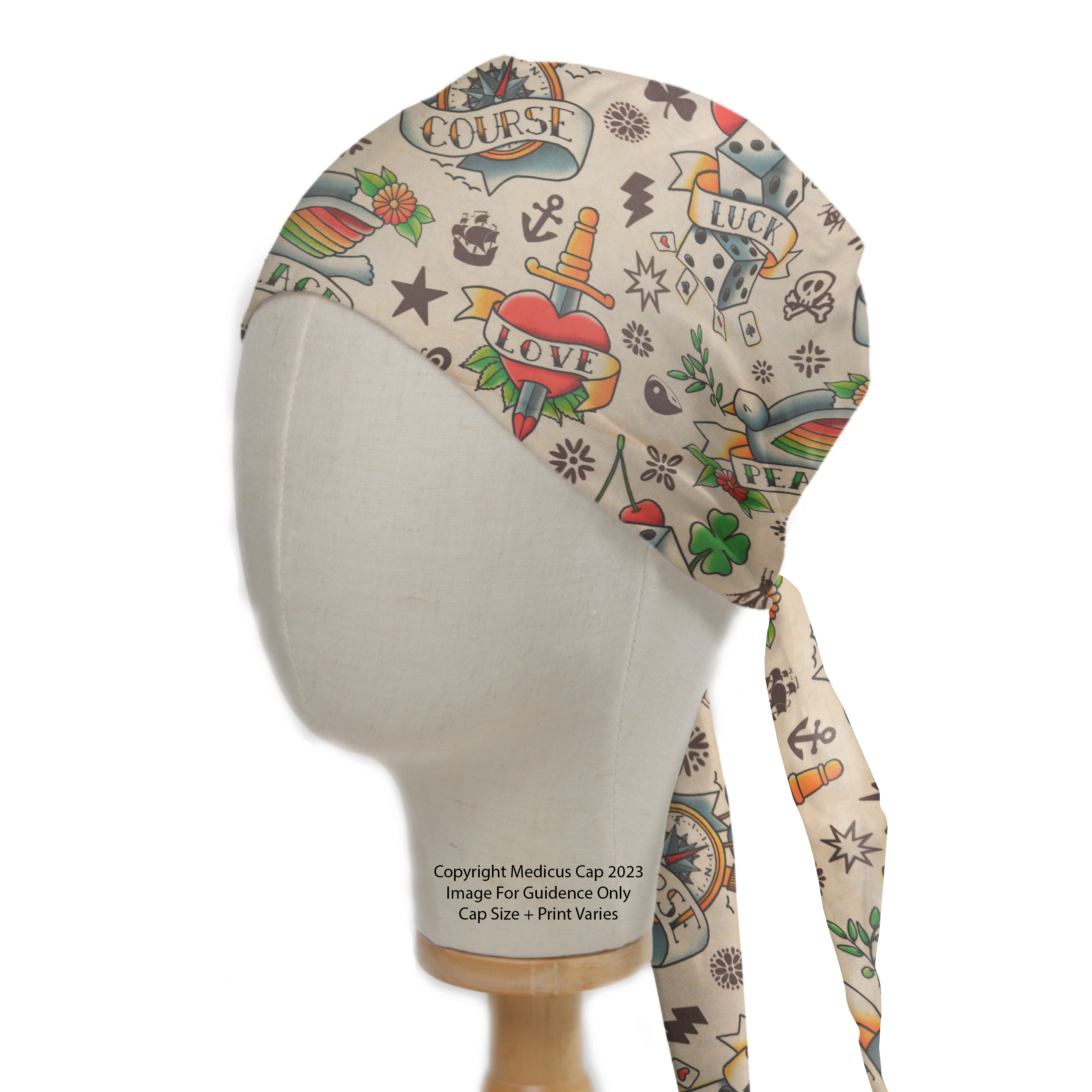 Tattoos #2 Luck Love Scrub Cap from Medicus Scrub Caps, featuring vintage tattoo designs with hearts, dice, and banners on a beige background.