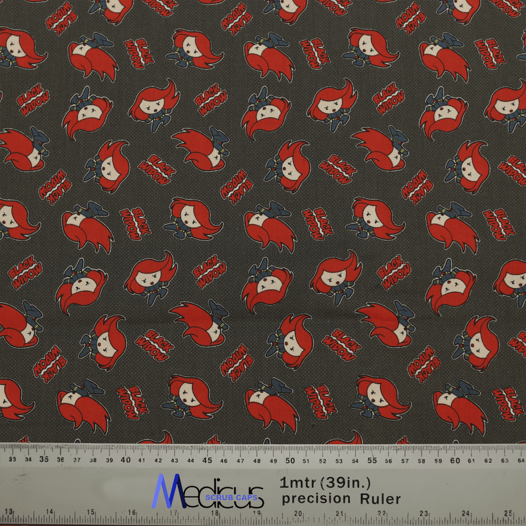 The Black Widow Red Kawaii Superhero Scrub Cap by Medicus Scrub Caps features patterned fabric with red-haired cartoon characters, Moxy Moxy text, and playful poses on a dark background. A ruler at the bottom measures 1 meter or 39 inches.