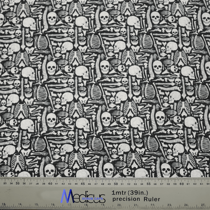 The Bones Cartoon Anatomy Scrub Cap by Medicus Scrub Caps features a black and white fabric pattern with playful cartoon skulls, crossed bones, and rib cages. Ideal for creating an eco-friendly scrub cap with fun medical flair. A ruler at the bottom shows measurements up to 1 meter (39 inches).