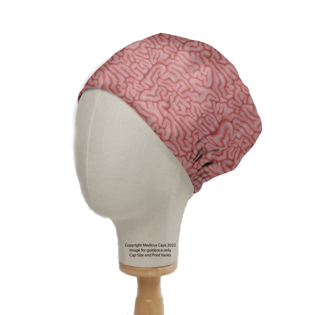 A mannequin head models the Brains Pink Human Scrub Cap by Medicus Scrub Caps, designed to resemble brain folds. Ideal for healthcare professionals, its sustainable style stands out against a plain background, merging functionality with uniqueness.