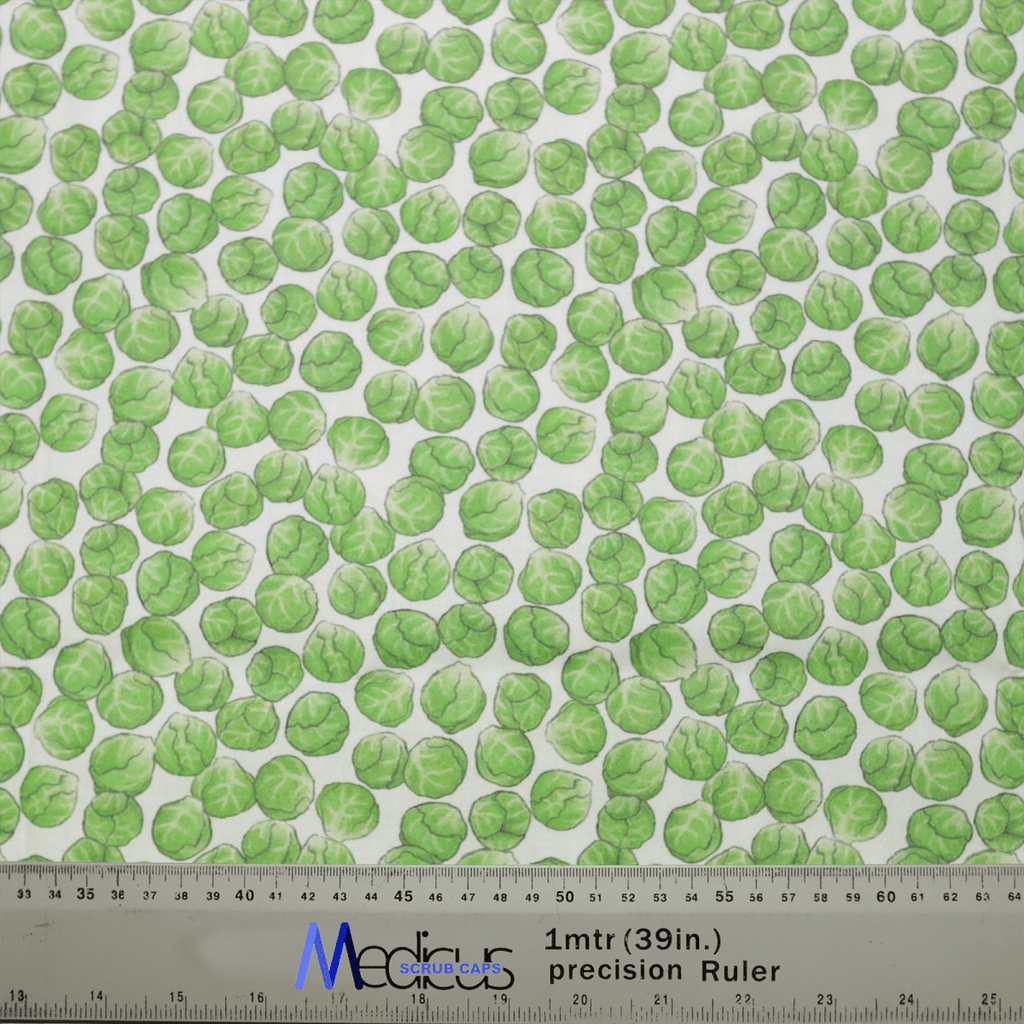 The Medicus Scrub Caps Brussel Sprouts Scrub Cap showcases a chic design with green Brussels sprouts on a light background. A Medoca 1mtr (39in.) precision ruler provides an accurate size reference, ideal for achieving a perfect fit, whether for garments or the scrub cap itself.