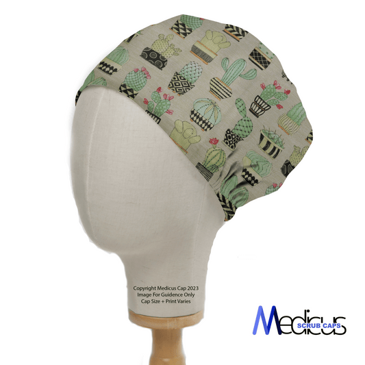 The Cactus #1 Abstract Pots Scrub Cap by Medicus Scrub Caps features green potted cacti on an eco-friendly fabric. The light background enhances the design, with the brands logo at the bottom right corner.