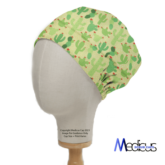 Cactus on Yellow Scrub Cap by Medicus Scrub Caps shown on a mannequin head, featuring vibrant cactus patterns in multiple shades of green for lasting comfort, with the brand logo at the bottom right.