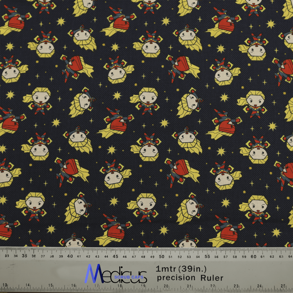 The Captain Marvel Kawaii Scrub Cap by Medicus Scrub Caps features fabric with cartoon characters on a navy background, adorned with heroic red and yellow designs. A ruler at the bottom displays inches and meters—ideal for crafting this unique scrub cap.