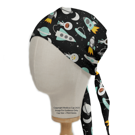 A mannequin head showcases the Cartoon Spaceships Blue Scrub Cap by Medicus Scrub Caps, decorated with rockets, planets, and stars in white, teal, and orange on black, exemplifying stylish sustainable healthcare accessories.