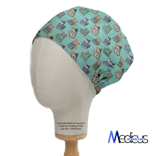 A mannequin head displays a teal Cat Doctor Surgeons Scrub Cap featuring cartoon dogs and a gathered back for snug fit. The text reads, Copyright Medicus Cap 2023 and Medicus Scrub Caps, highlighting this playful, eco-friendly cap perfect for medical professionals seeking personalization.